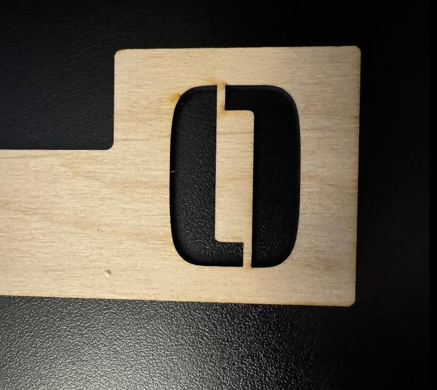 Tab style engraved baltic birch wooden record divider with a  cut out letter O.